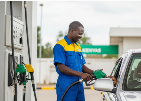 Man putting petrol in a car